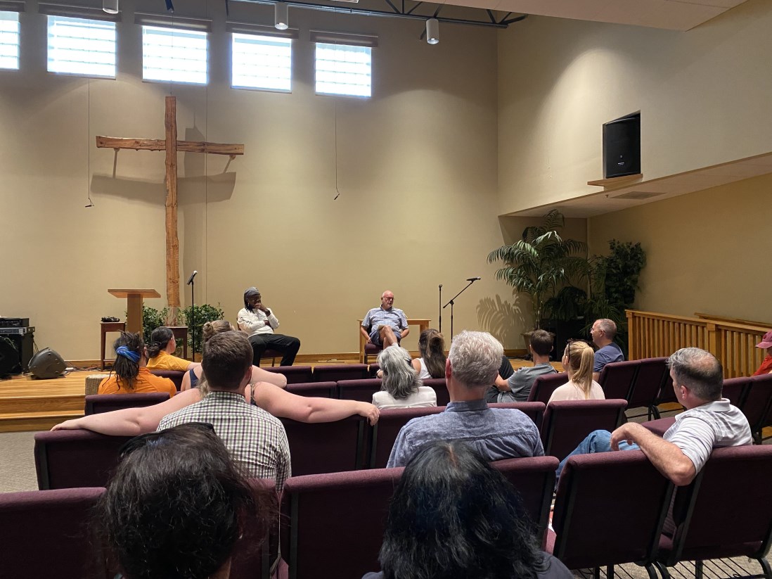 The Willowdale worship space with its cross and gathered community